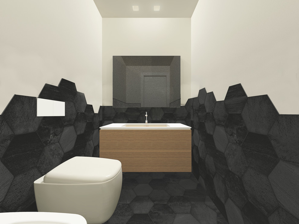 Esempio di un piccolo bagno di servizio design con ante lisce, ante in legno chiaro, WC sospeso, piastrelle nere, piastrelle in gres porcellanato, pareti bianche, pavimento in gres porcellanato, lavabo sottopiano, top in vetro e pavimento nero