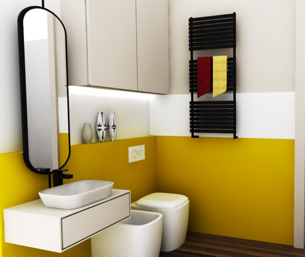 Kleine Mid-Century Gästetoilette mit flächenbündigen Schrankfronten, beigen Schränken, gelben Fliesen, gelber Wandfarbe, dunklem Holzboden, Waschtisch aus Holz, braunem Boden, beiger Waschtischplatte und schwebendem Waschtisch in Mailand