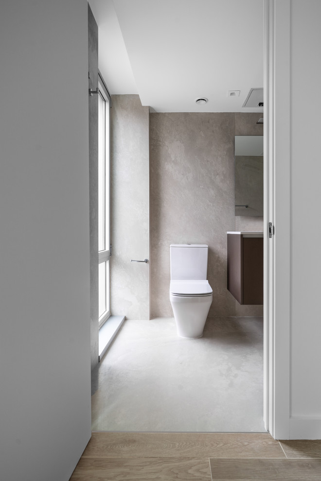 Foto di un bagno di servizio moderno con piastrelle in gres porcellanato, pareti grigie, pavimento in gres porcellanato e pavimento grigio