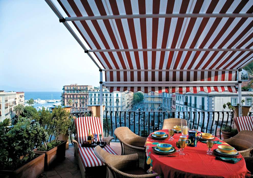 Balcony - traditional balcony idea in Naples with an awning