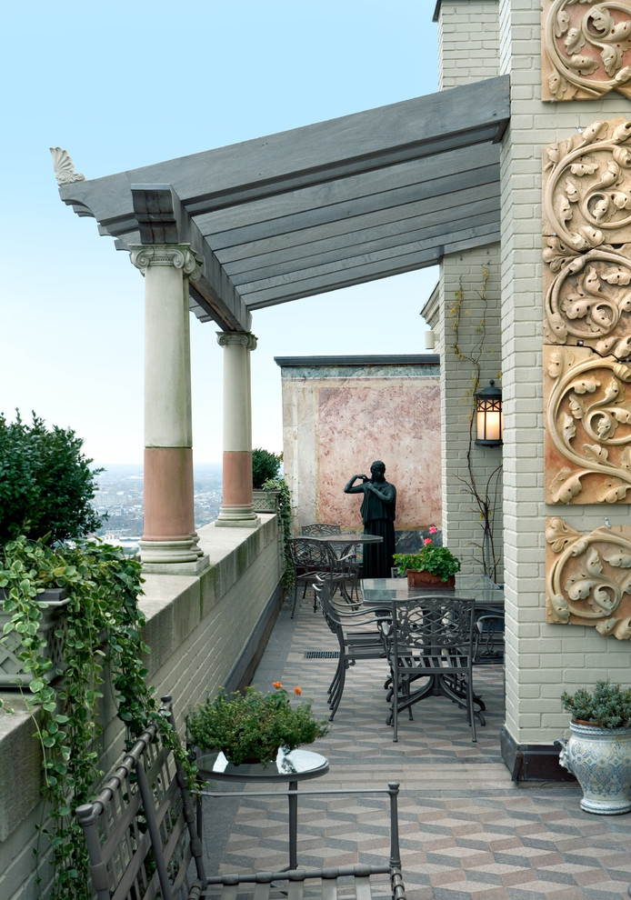 Inspiration for a mediterranean balcony remodel in Philadelphia with a pergola