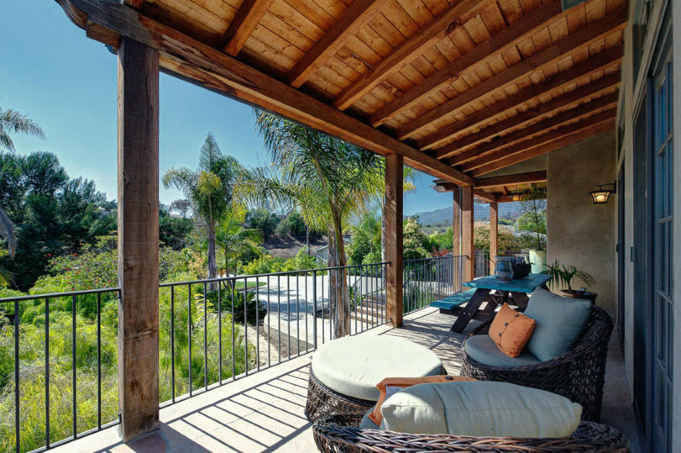 Photo of a medium sized mediterranean balcony in Santa Barbara with a roof extension.