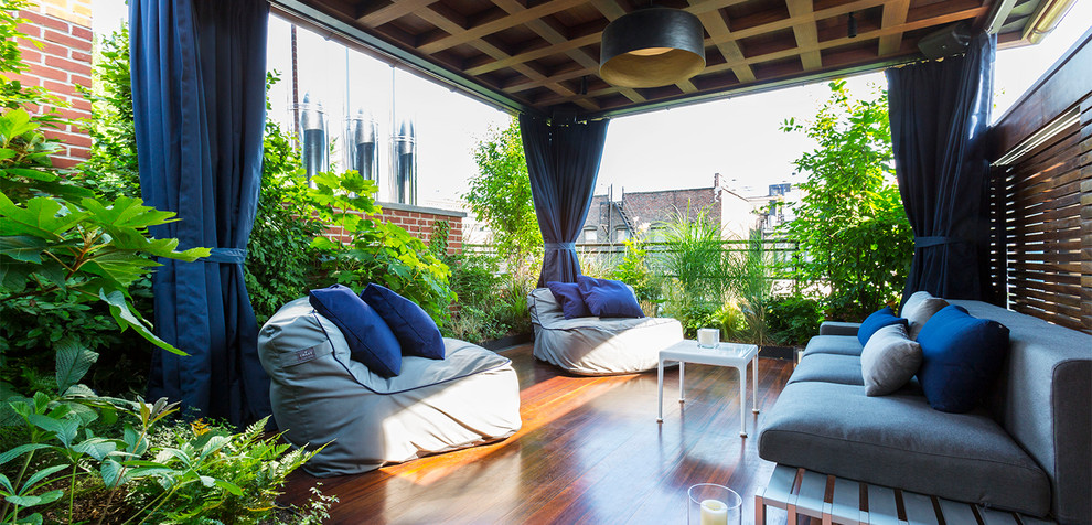Design ideas for a medium sized contemporary balcony in New York with a pergola.