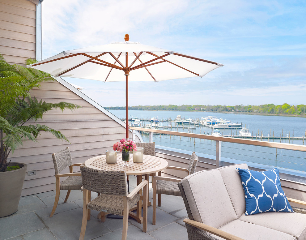 Inspiration for a coastal cable railing balcony remodel in New York