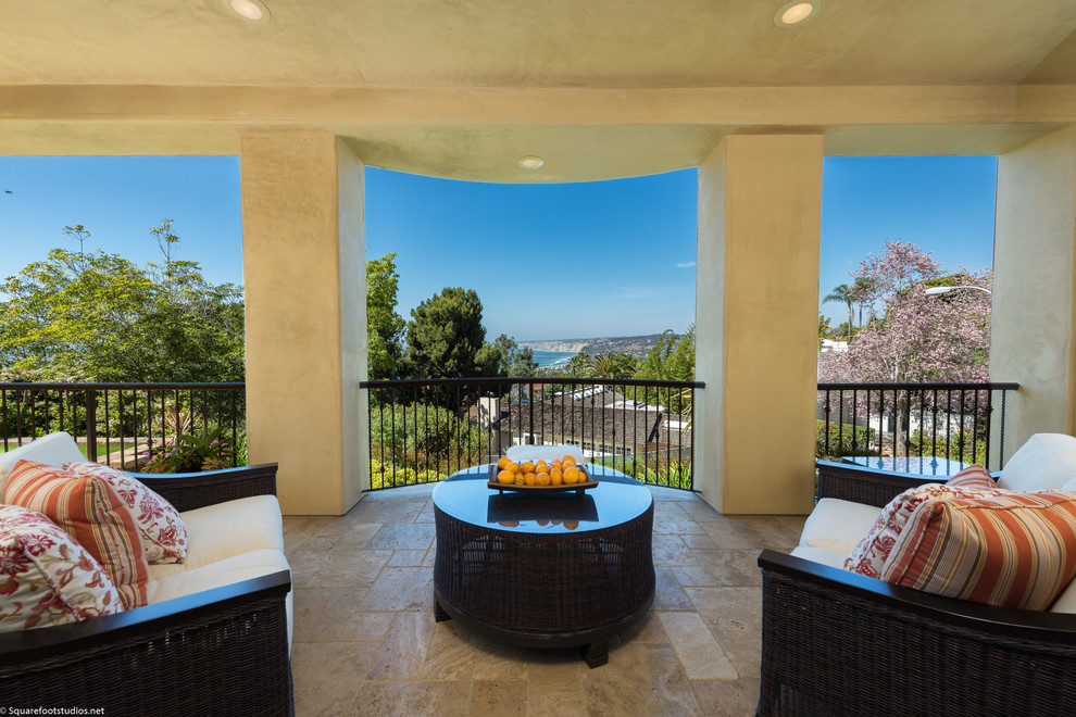 Mid-sized tuscan balcony photo in San Diego with a pergola