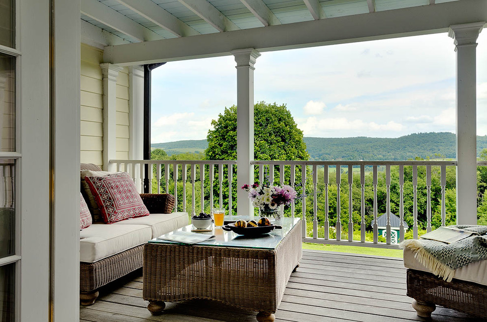 Rural balcony in New York with a roof extension.