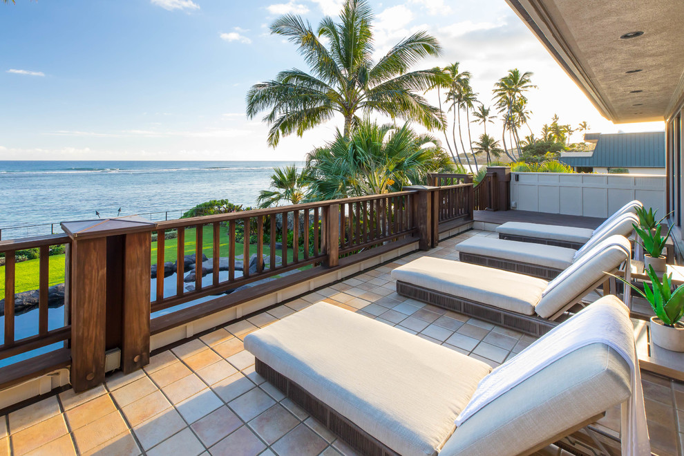 Inspiration for a world-inspired wood railing balcony in Hawaii.