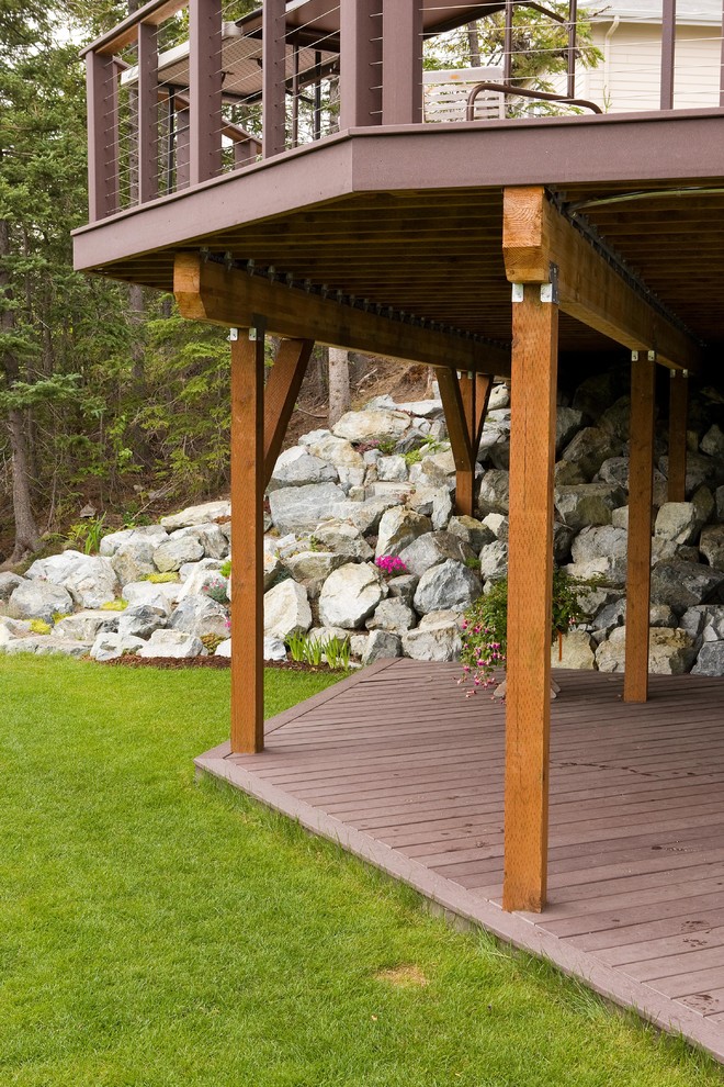 This is an example of a medium sized contemporary wood railing balcony in Other with no cover.
