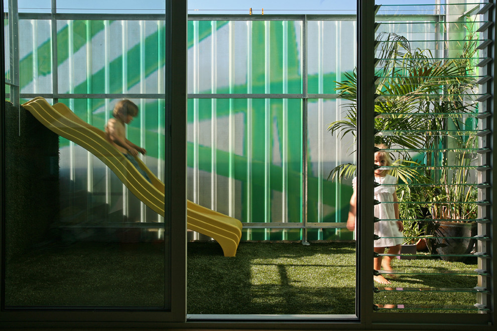 Medium sized contemporary balcony in Melbourne with an awning.