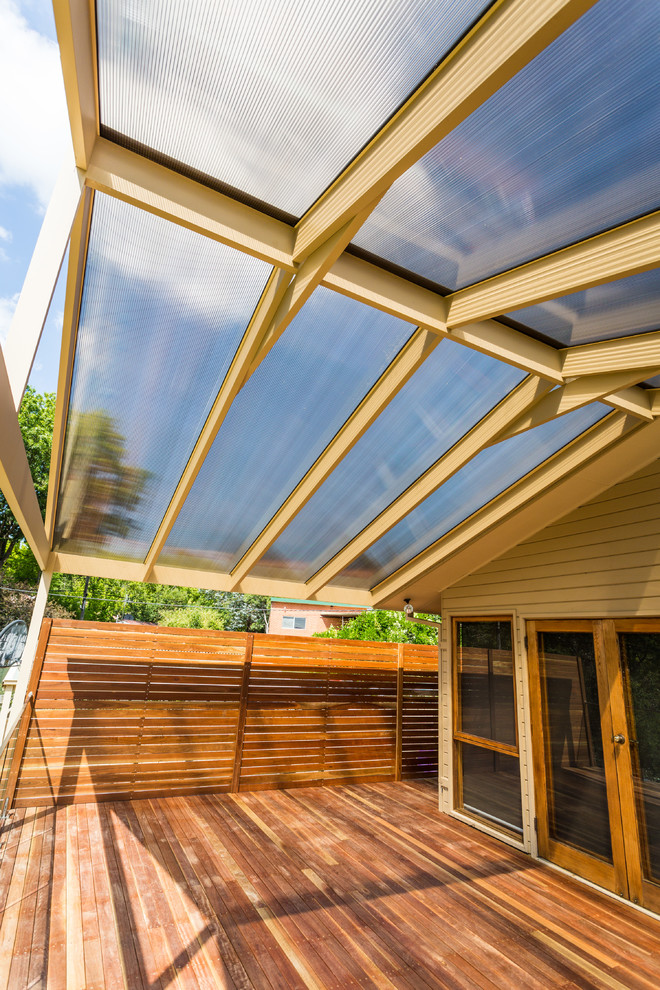 Inspiration for a large contemporary balcony remodel in Canberra - Queanbeyan with a pergola