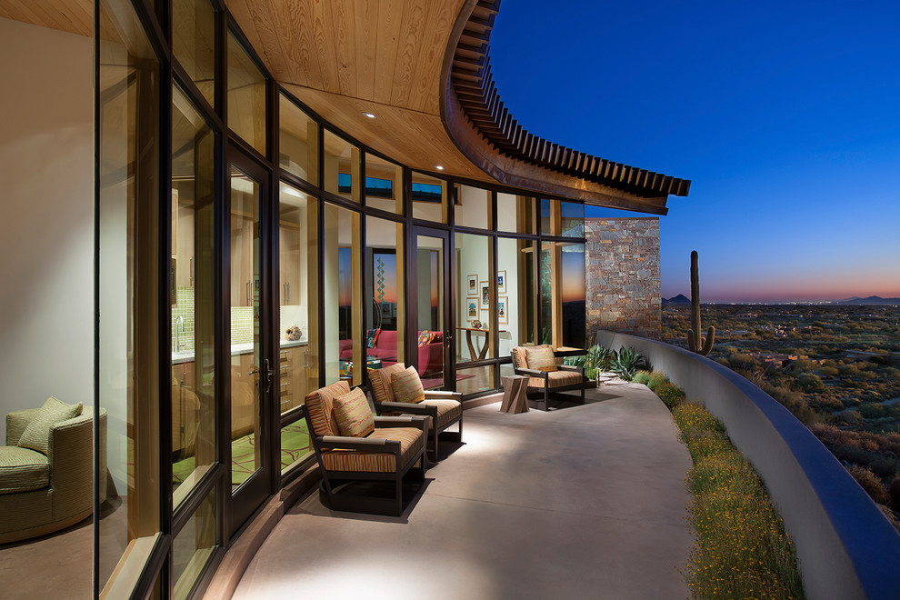 Balcony - large contemporary balcony idea in Phoenix with a roof extension