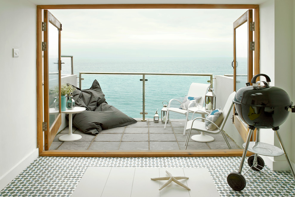 Design ideas for a small nautical balcony in London with no cover.