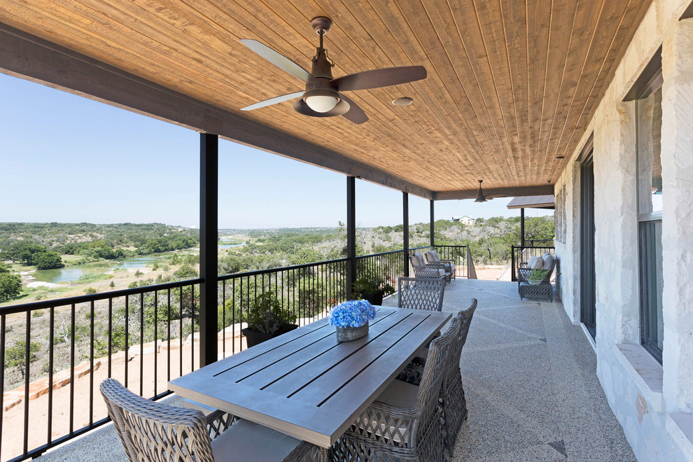 Design ideas for a country balcony in Austin with a roof extension.