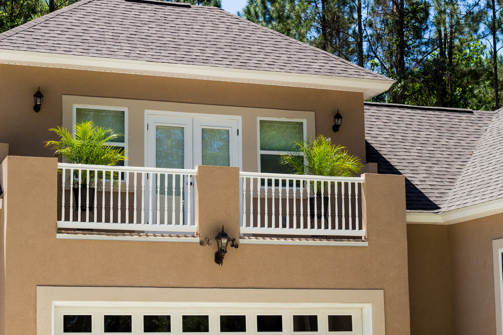 Inspiration for a mid-sized mediterranean balcony remodel in Jacksonville with a roof extension