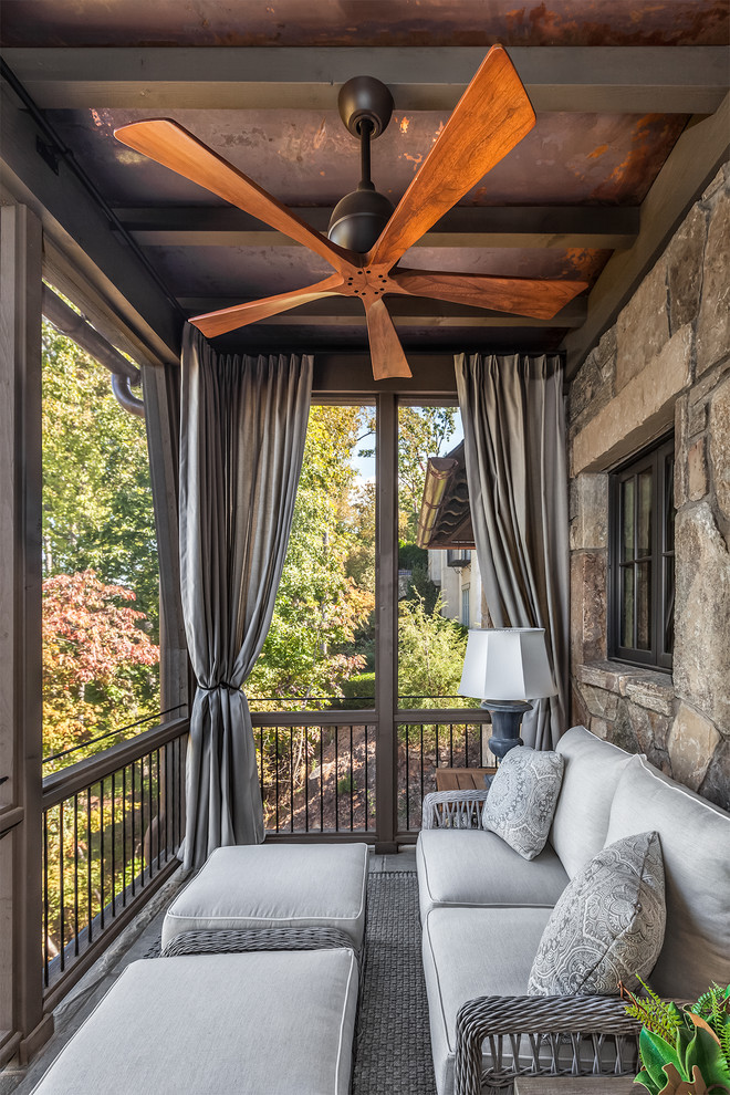 Balcony - mid-sized rustic privacy balcony idea in Other with a roof extension