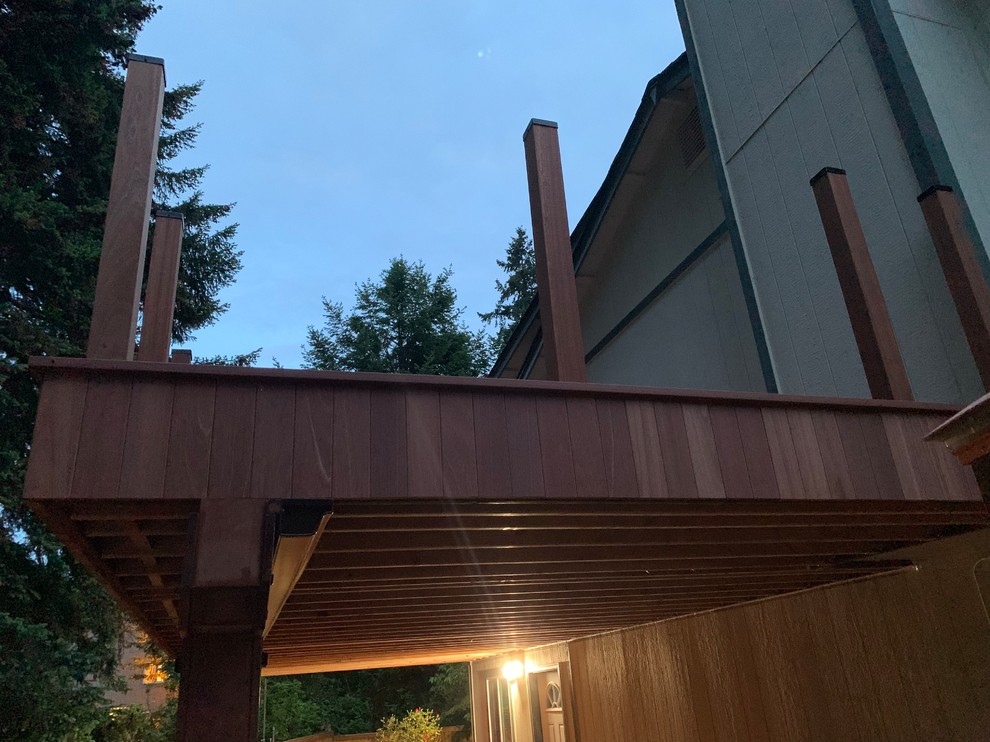 This is an example of a large classic wood railing balcony in Seattle.