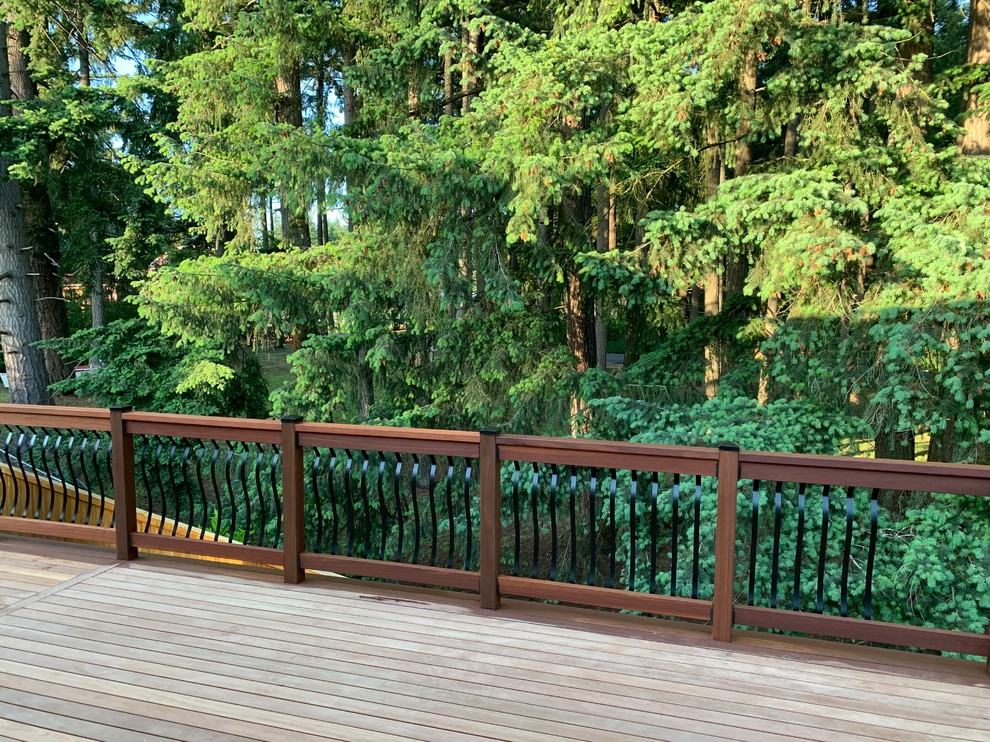 Large arts and crafts wood railing balcony photo in Seattle
