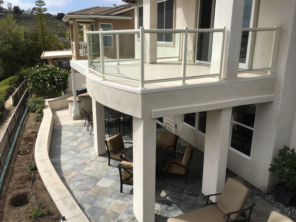 Medium sized classic balcony in Orange County with a pergola.