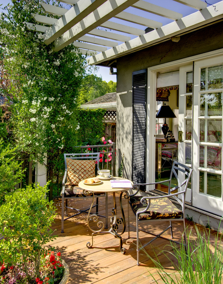 This is an example of a medium sized traditional private balcony in San Francisco with a pergola.
