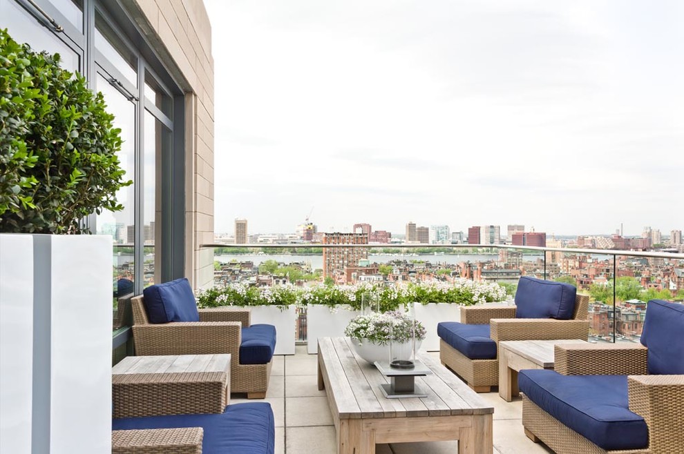 Design ideas for a contemporary balcony in Boston with a potted garden and no cover.