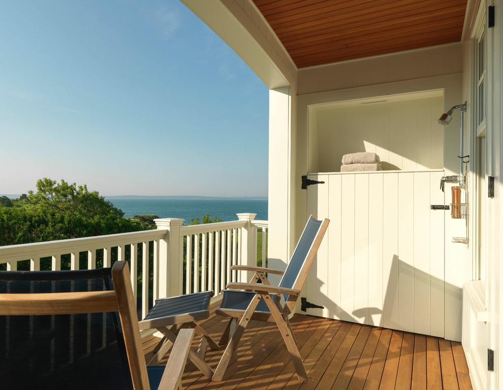 Design ideas for a medium sized beach style wood railing balcony in Other with a roof extension.