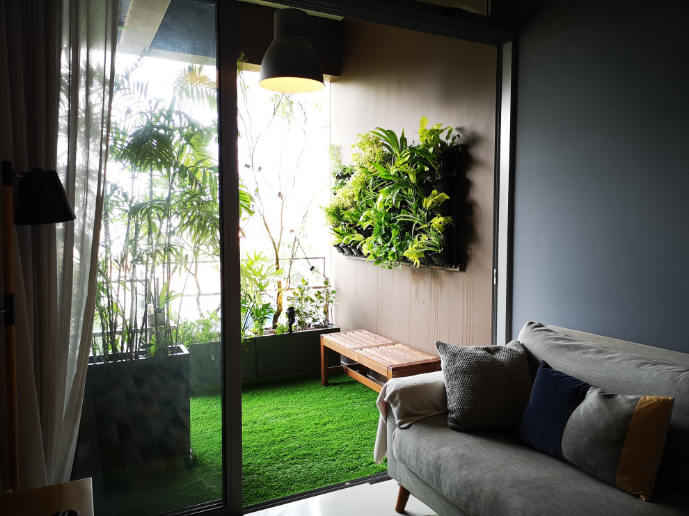 Cozy extended living room balcony Modern Balcony Singapore by