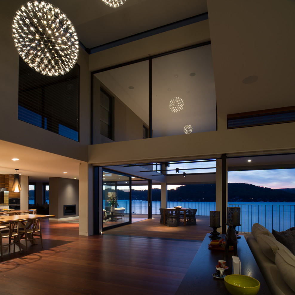 Design ideas for a large contemporary balcony in Sydney with a roof extension.
