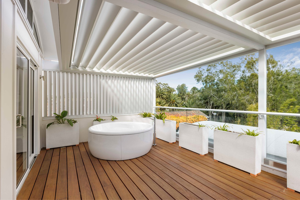 Contemporary balcony in Sydney with an awning.