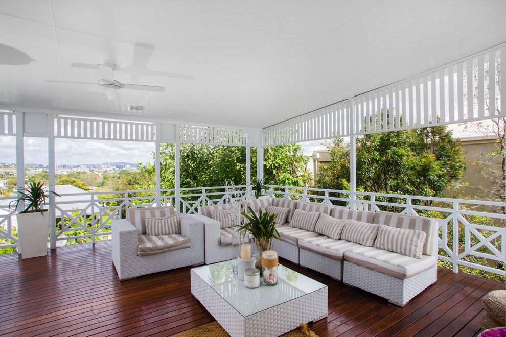 This is an example of a large classic balcony in Brisbane with a roof extension.
