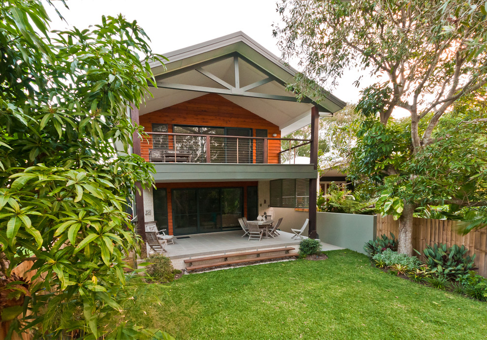 Inspiration for a contemporary balcony in Sunshine Coast with a roof extension.