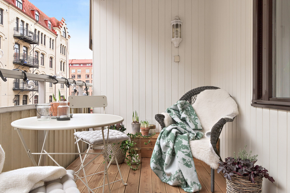 Photo of a scandinavian metal railing balcony in Gothenburg with a potted garden.