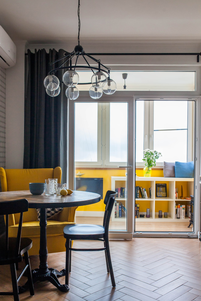 This is an example of a medium sized scandi dining room in Moscow.