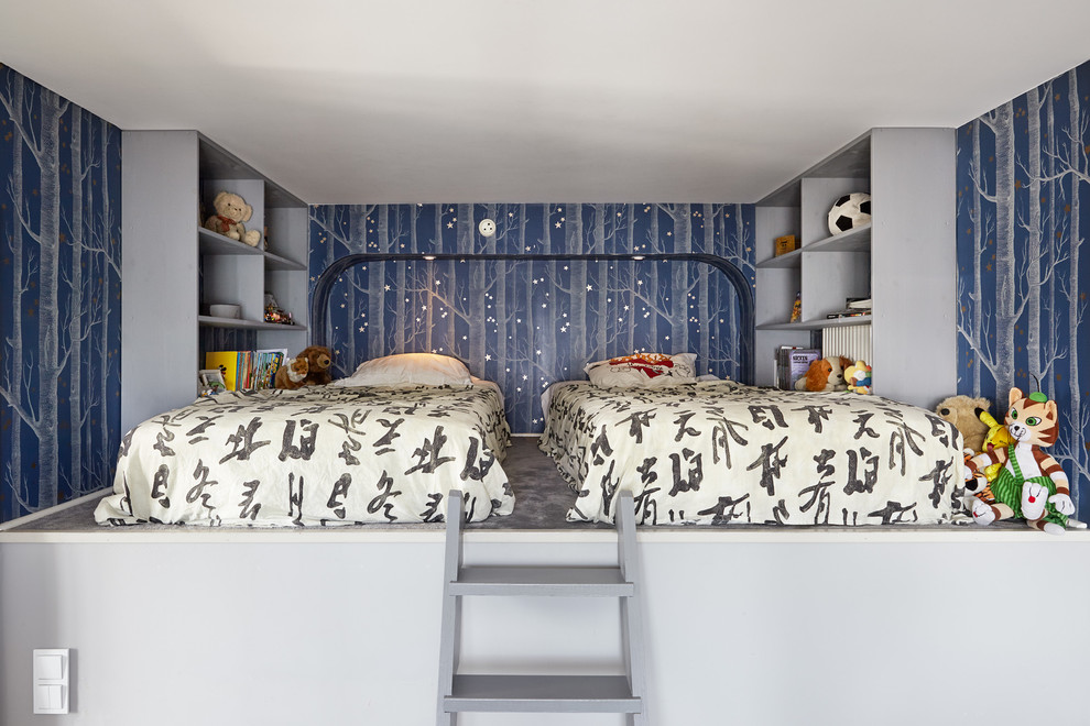 Esempio di una piccola cameretta per bambini da 4 a 10 anni minimalista con pareti blu