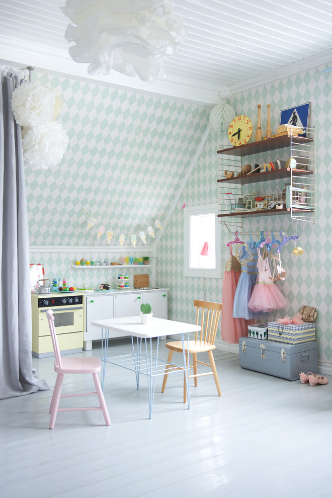 Example of a large danish girl painted wood floor kids' room design in Other with multicolored walls