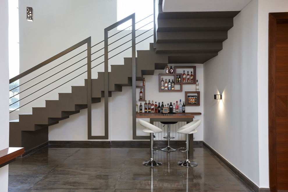 Inspiration for a small contemporary gray floor seated home bar remodel in Other with floating shelves