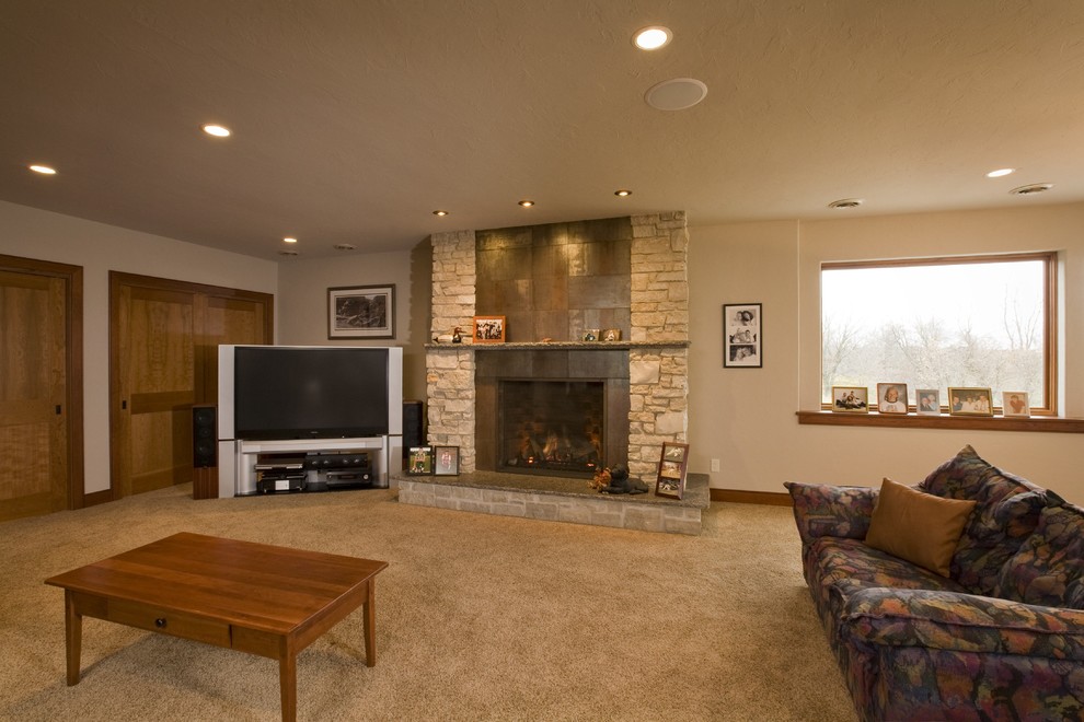 Inspiration for a large transitional walk-out carpeted basement remodel in Other with white walls, a standard fireplace and a tile fireplace