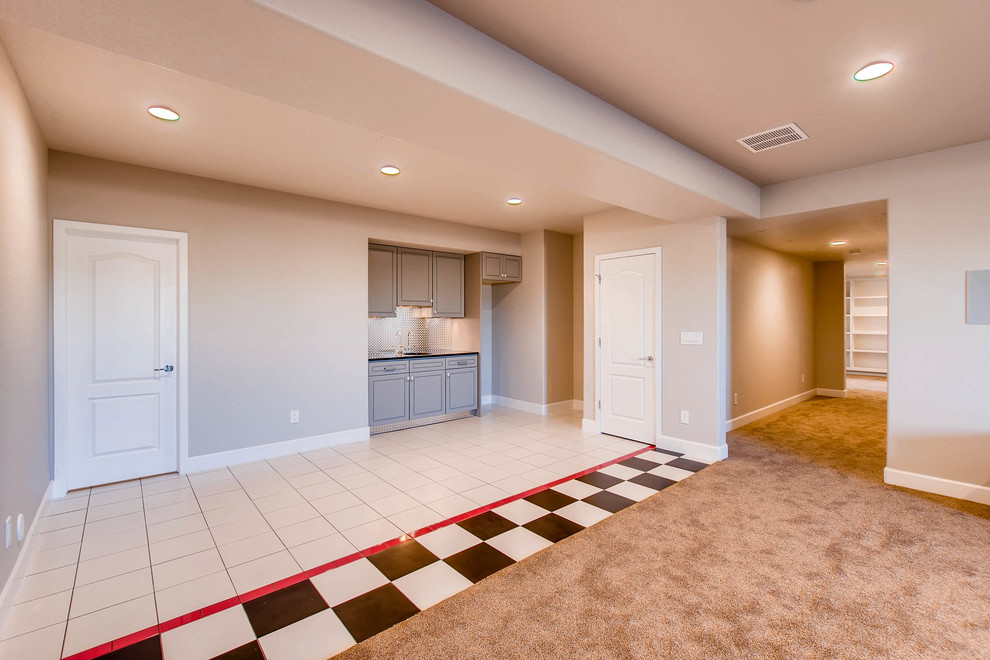 Contemporary basement in Denver with carpet.