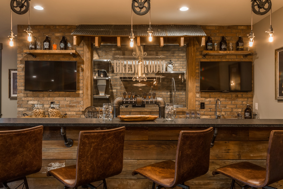 Example of a mid-sized mountain style underground basement design in Indianapolis with beige walls and no fireplace