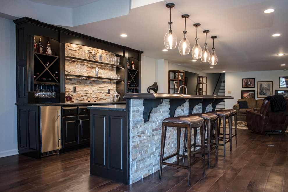 This is an example of a large classic home bar in Louisville with medium hardwood flooring and brown floors.