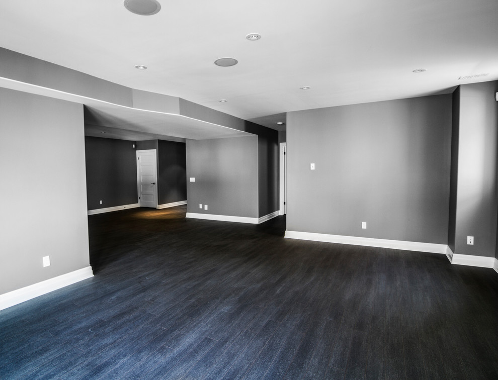 Photo of a medium sized contemporary walk-out basement in Toronto with grey walls.