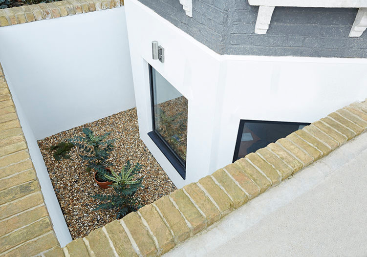 8. Basement lightwell Contemporary Basement London by ARCHEA
