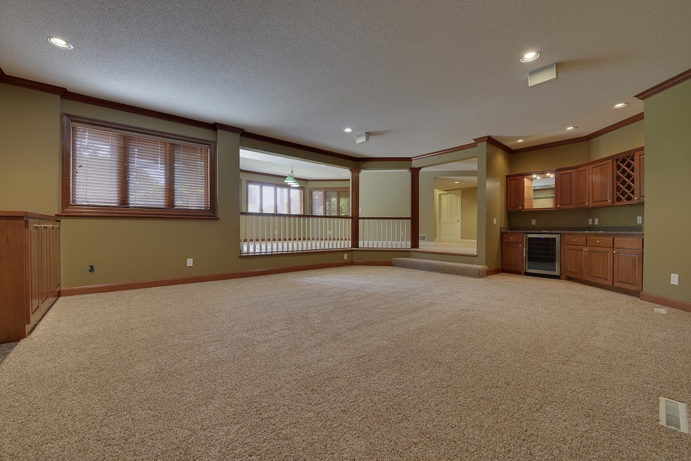 Example of a large classic walk-out basement design in Minneapolis