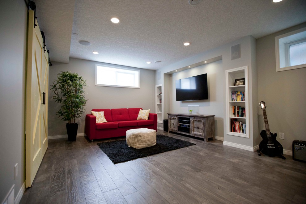 Example of an eclectic basement design in Calgary