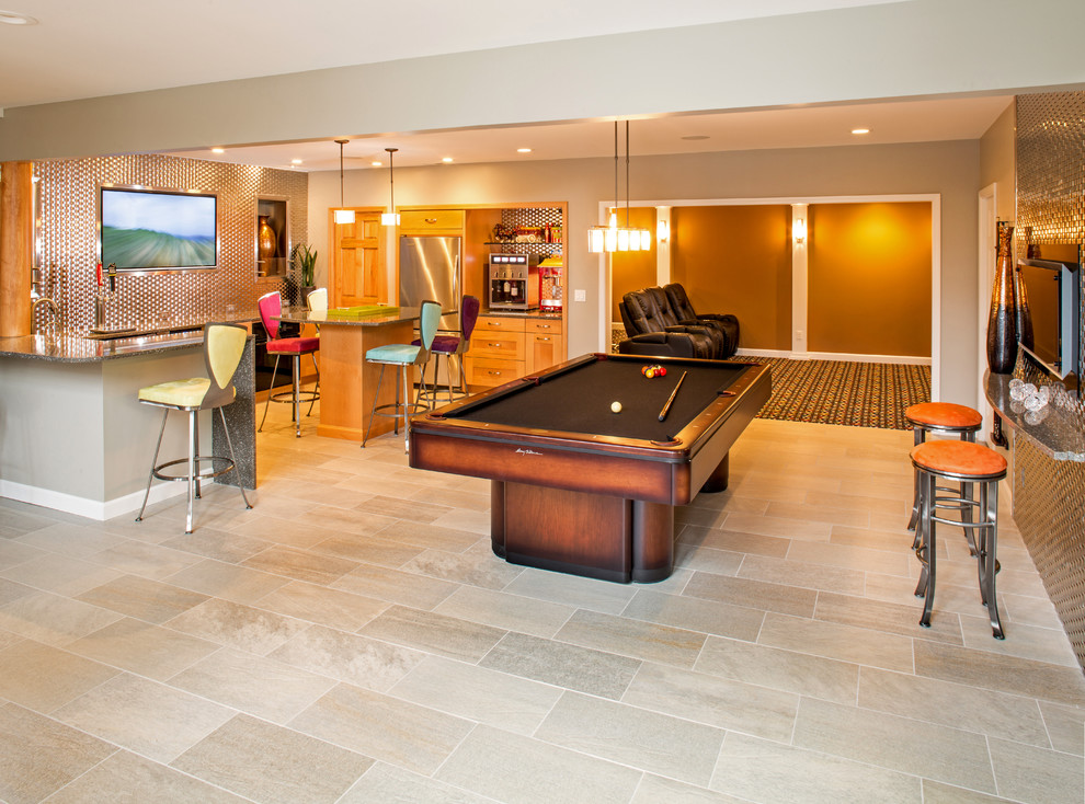 Example of a huge eclectic walk-out ceramic tile basement design in St Louis with orange walls