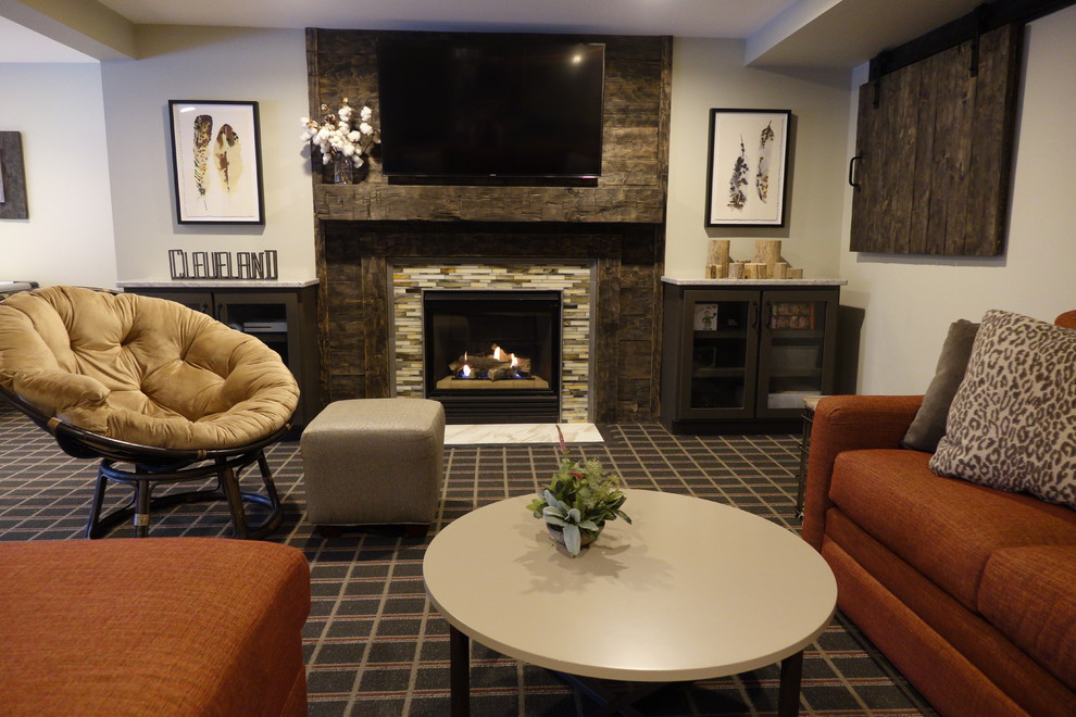 Huge elegant walk-out carpeted and multicolored floor basement photo in Cleveland with gray walls, a standard fireplace and a tile fireplace