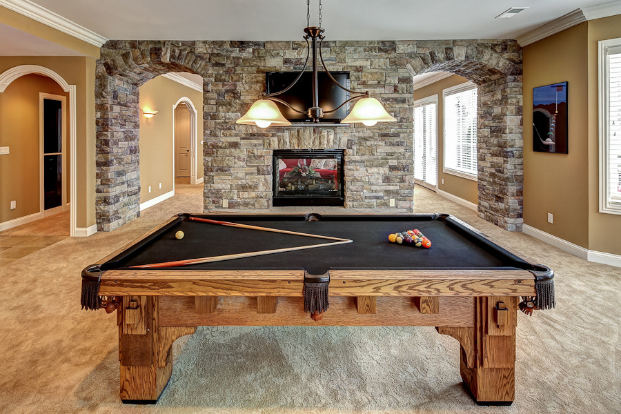 Inspiration for a timeless basement remodel in Louisville with a brick fireplace