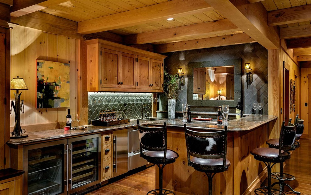 This is an example of a large rustic basement in Burlington with a home bar, medium hardwood flooring and no fireplace.