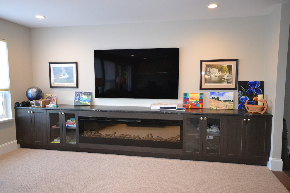 This is an example of a medium sized classic walk-out basement in Vancouver with carpet and a standard fireplace.