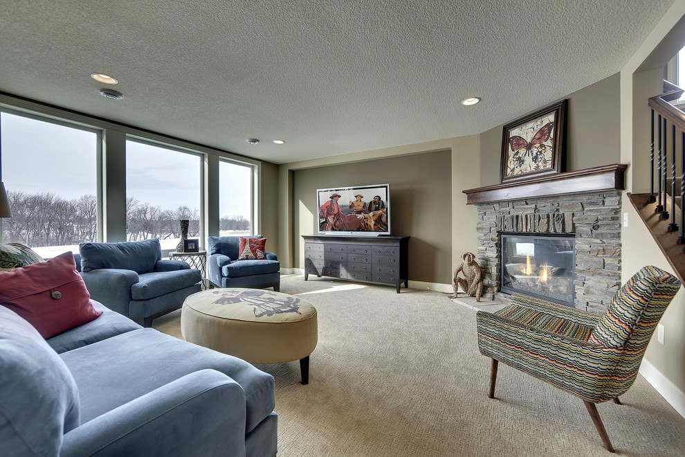 This is an example of a classic basement in New York with brown walls, carpet, a standard fireplace and a stone fireplace surround.