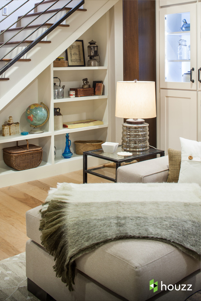 Example of a classic walk-out light wood floor basement design in Other